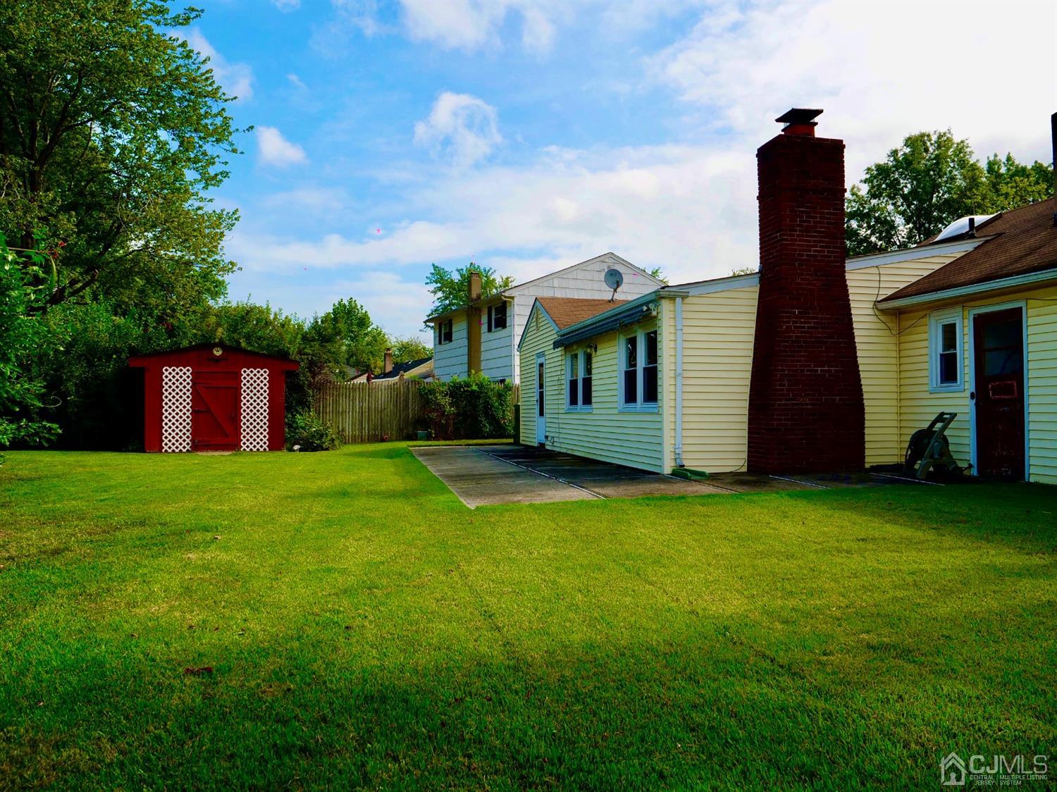 5 Idlewild Road Edison, NJ 08817 - Photo 2 of 13 a view of a house with backyard and garden