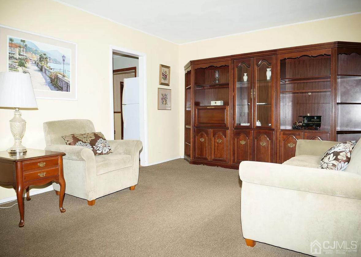 5 Idlewild Road Edison, NJ 08817 - Photo 11 of 13 a living room with furniture and dining table