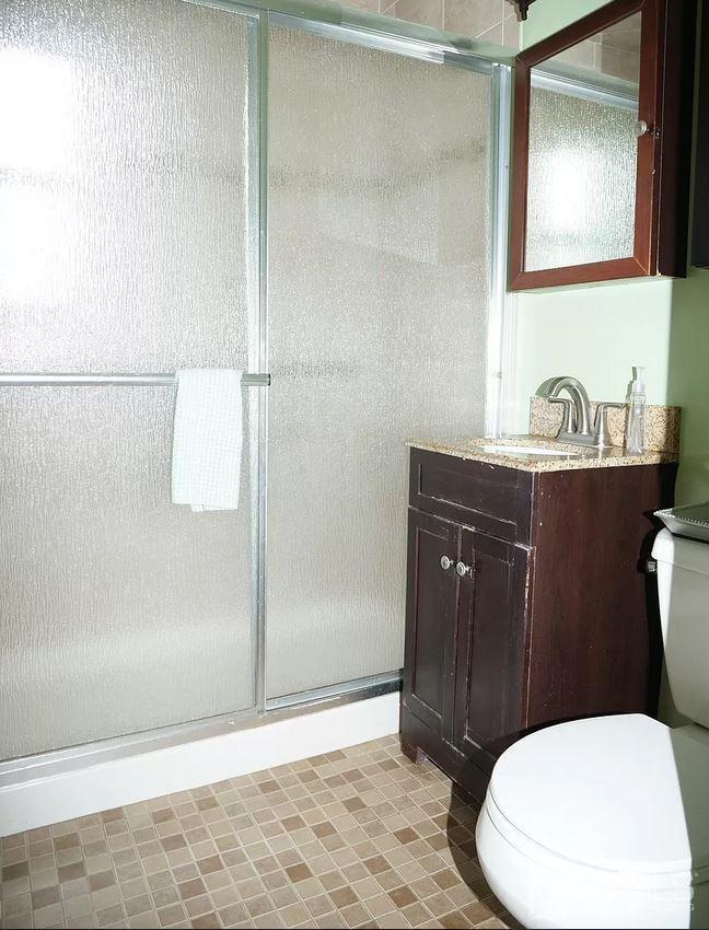 5 Idlewild Road Edison, NJ 08817 - Photo 4 of 13 a bathroom with a granite countertop toilet sink and mirror
