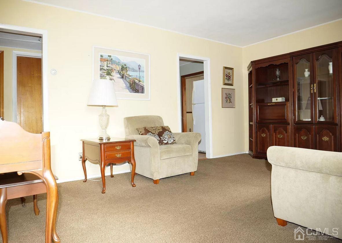 5 Idlewild Road Edison, NJ 08817 - Photo 10 of 13 a living room with furniture and a lamp