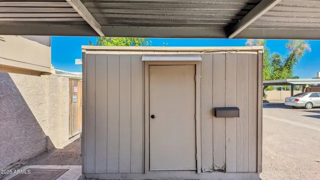 a view of a house with wooden fence