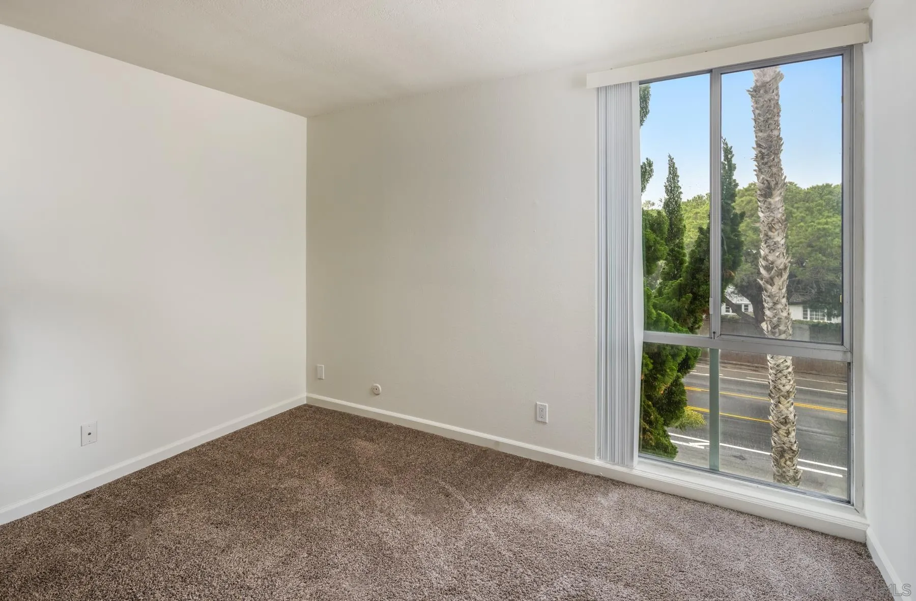 6455 La Jolla Boulevard, Unit 203 La Jolla, CA 92037 - Photo 15 of 21 an empty room with windows