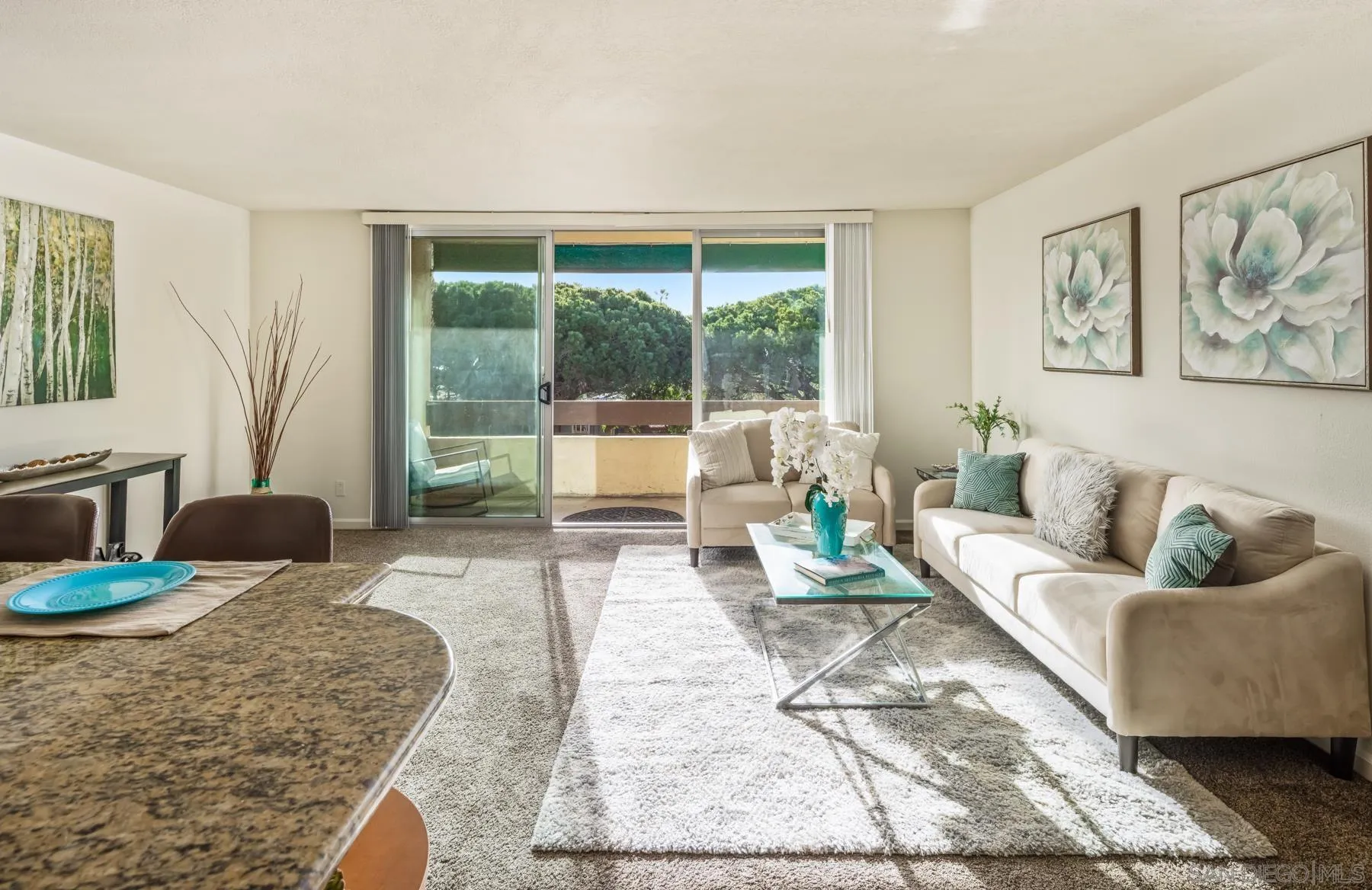 6455 La Jolla Boulevard, Unit 203 La Jolla, CA 92037 - Photo 4 of 21 a living room with furniture and a large window