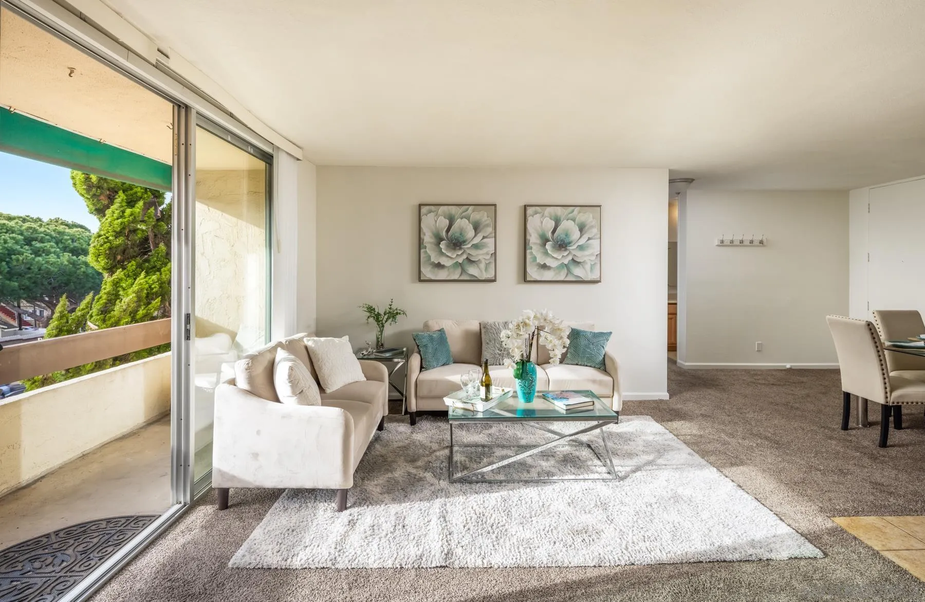 6455 La Jolla Boulevard, Unit 203 La Jolla, CA 92037 - Photo 5 of 21 a living room with furniture and a large window