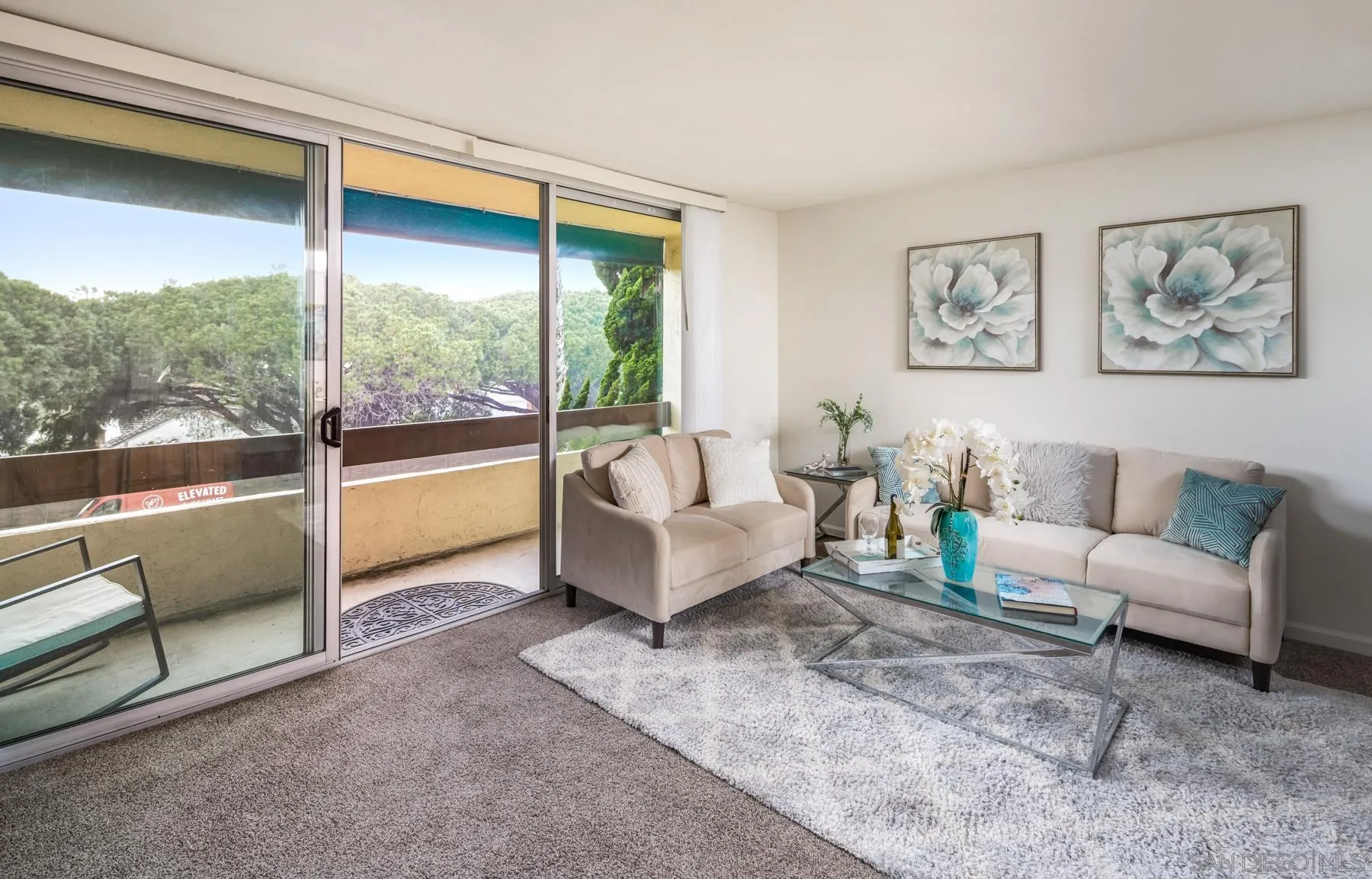6455 La Jolla Boulevard, Unit 203 La Jolla, CA 92037 - Photo 7 of 21 a living room with furniture and a large window