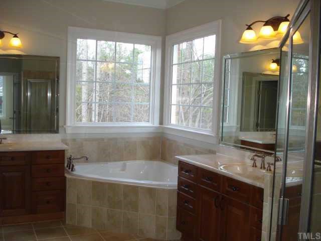5308 Landguard Drive Raleigh, NC 27613 - Photo 7 of 12 a bathroom with a sink and a bathtub