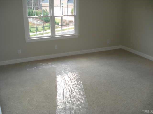 5308 Landguard Drive Raleigh, NC 27613 - Photo 10 of 12 an empty room with windows