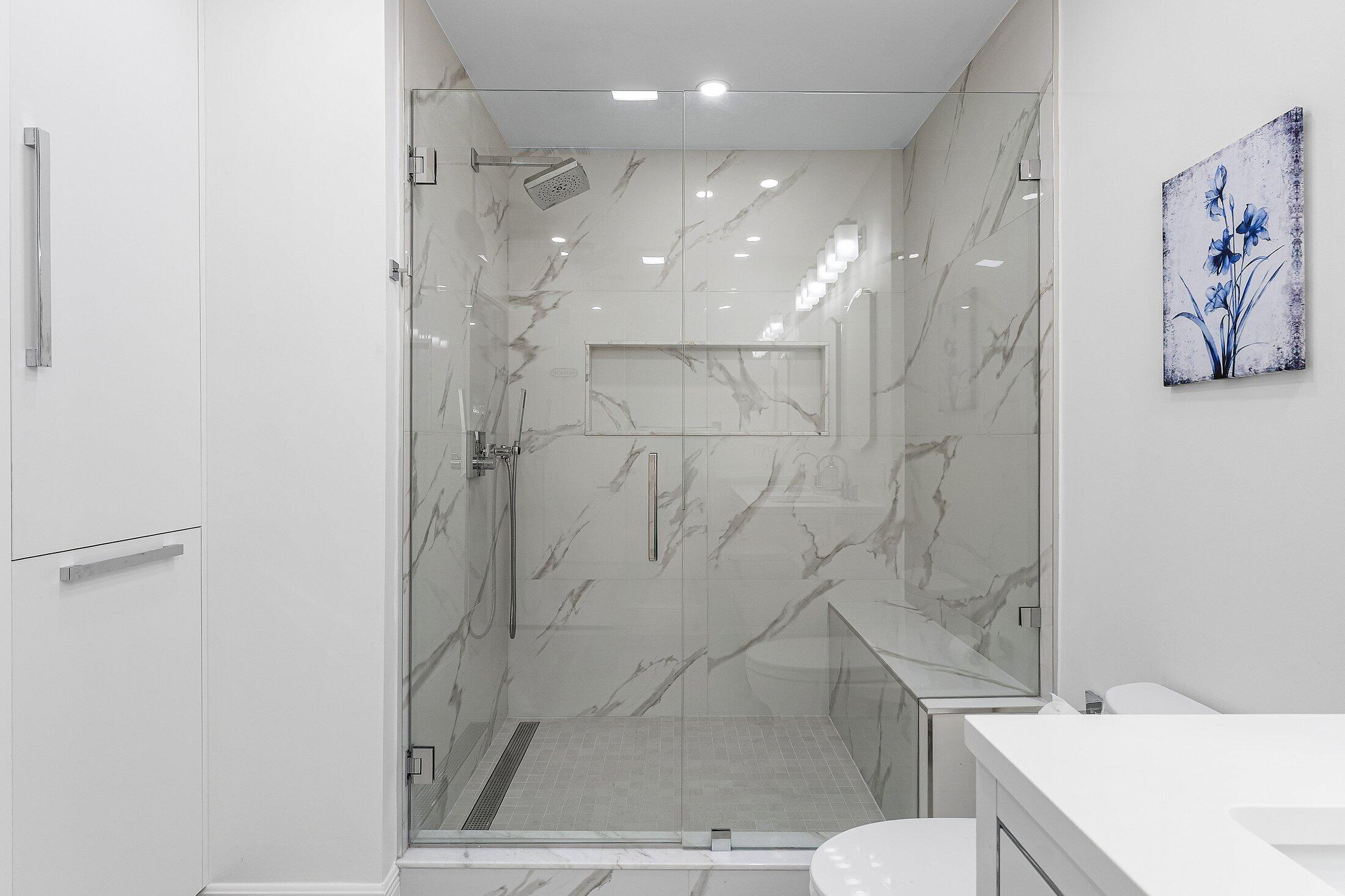 36 Westgate Lane, Unit D Boynton Beach, FL 33436 - Photo 18 of 51 a bathroom with a shower and a toilet