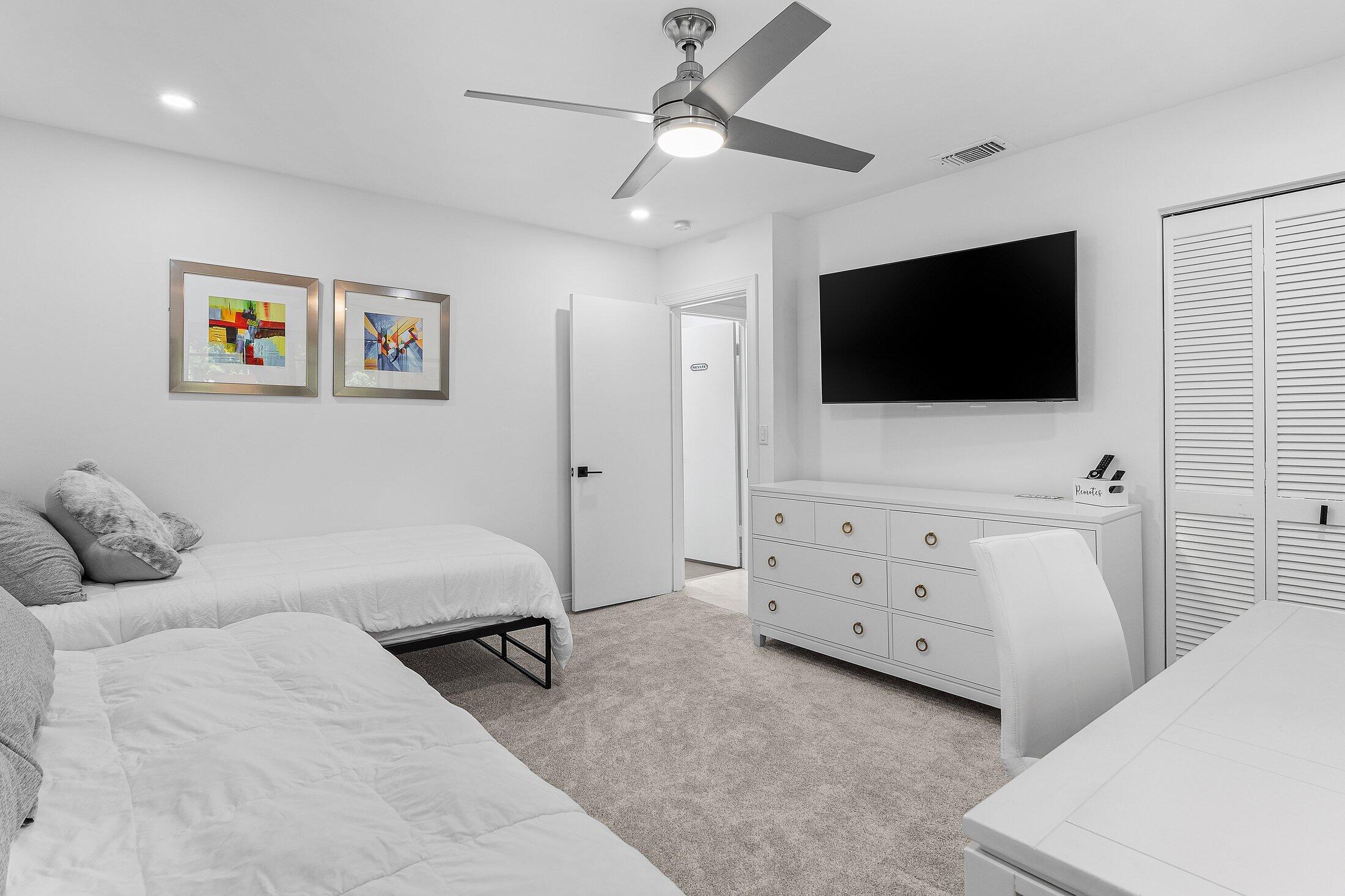 36 Westgate Lane, Unit D Boynton Beach, FL 33436 - Photo 20 of 51 a bedroom with furniture and a flat screen tv