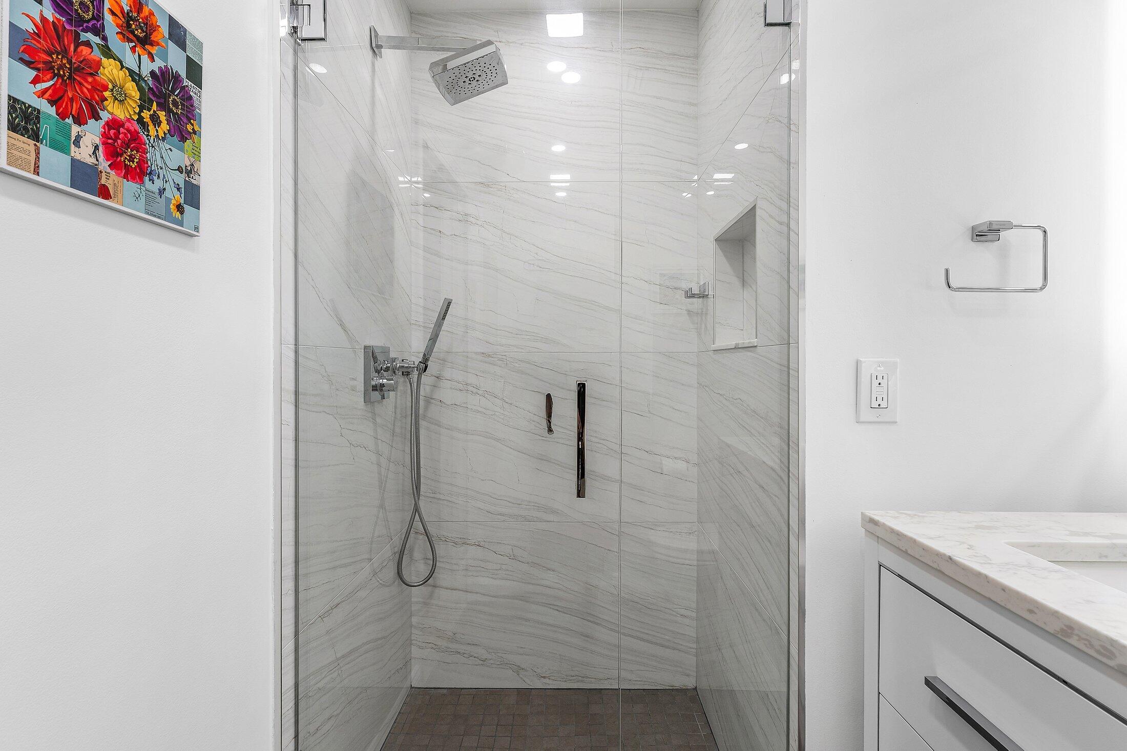 36 Westgate Lane, Unit D Boynton Beach, FL 33436 - Photo 22 of 51 a bathroom with a shower
