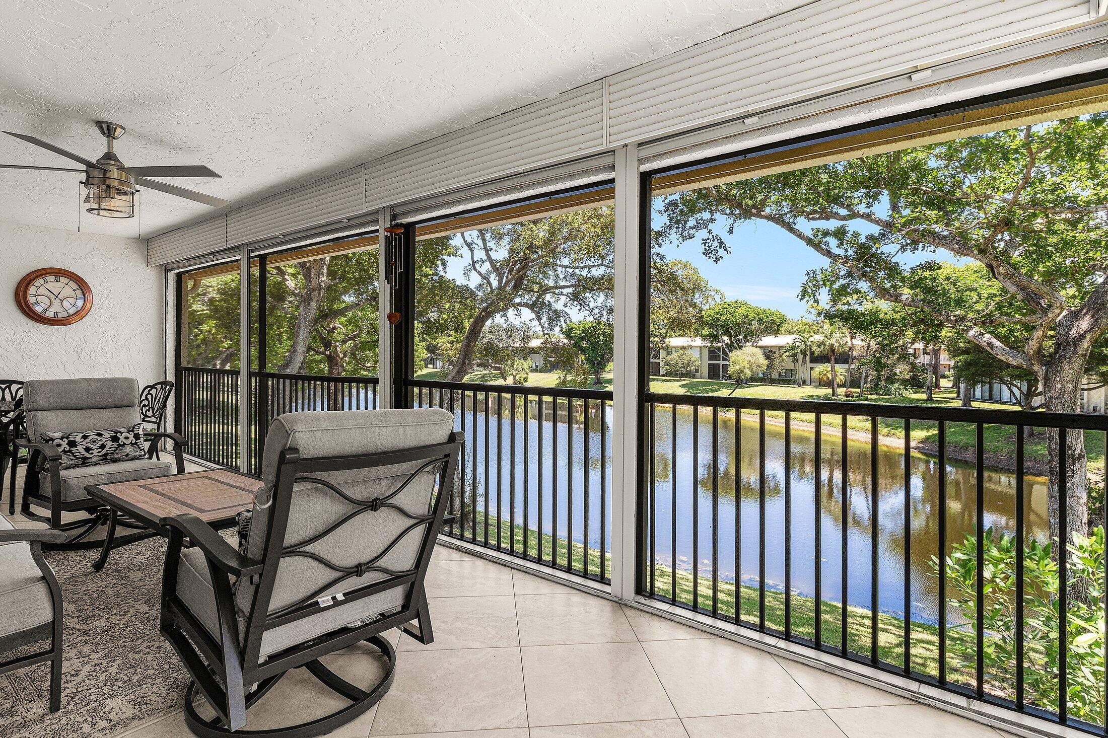 36 Westgate Lane, Unit D Boynton Beach, FL 33436 - Photo 23 of 51 a view of a chairs and table in the balcony