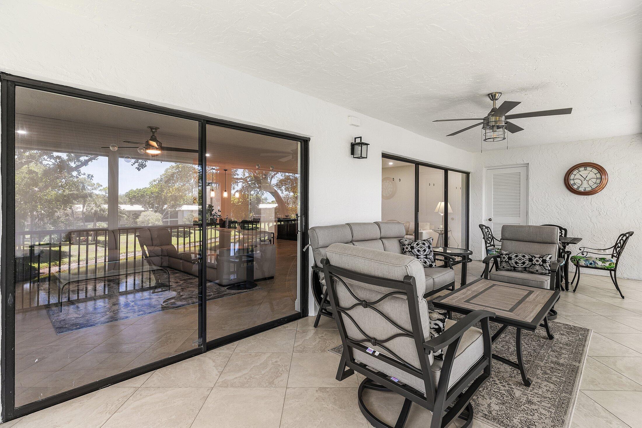 36 Westgate Lane, Unit D Boynton Beach, FL 33436 - Photo 25 of 51 a view of a livingroom with furniture and a large window