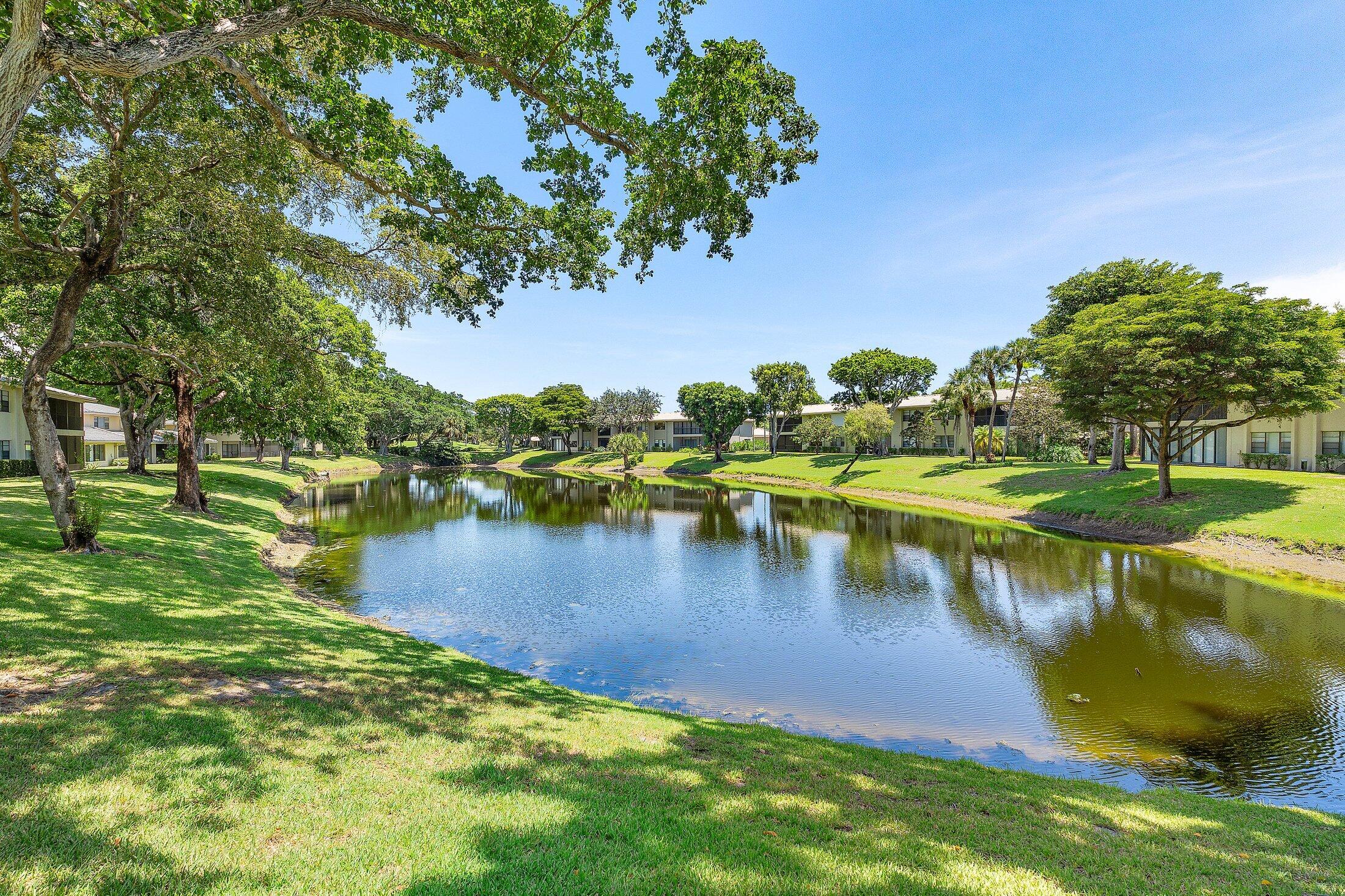 36 Westgate Lane, Unit D Boynton Beach, FL 33436 - Photo 27 of 51 a view of a lake with houses