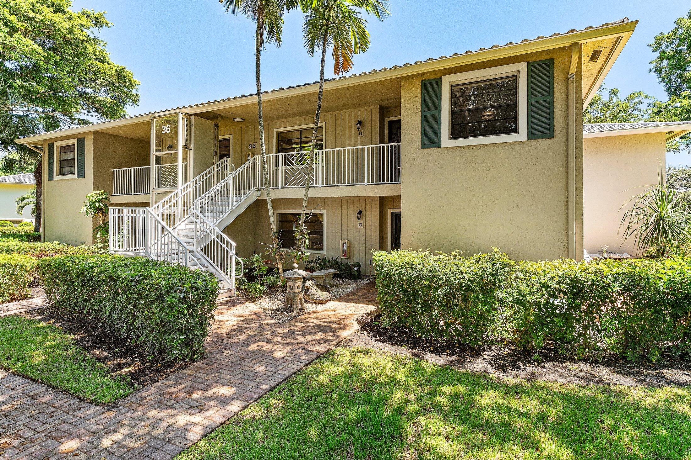36 Westgate Lane, Unit D Boynton Beach, FL 33436 - Photo 30 of 51 a front view of a house with a yard