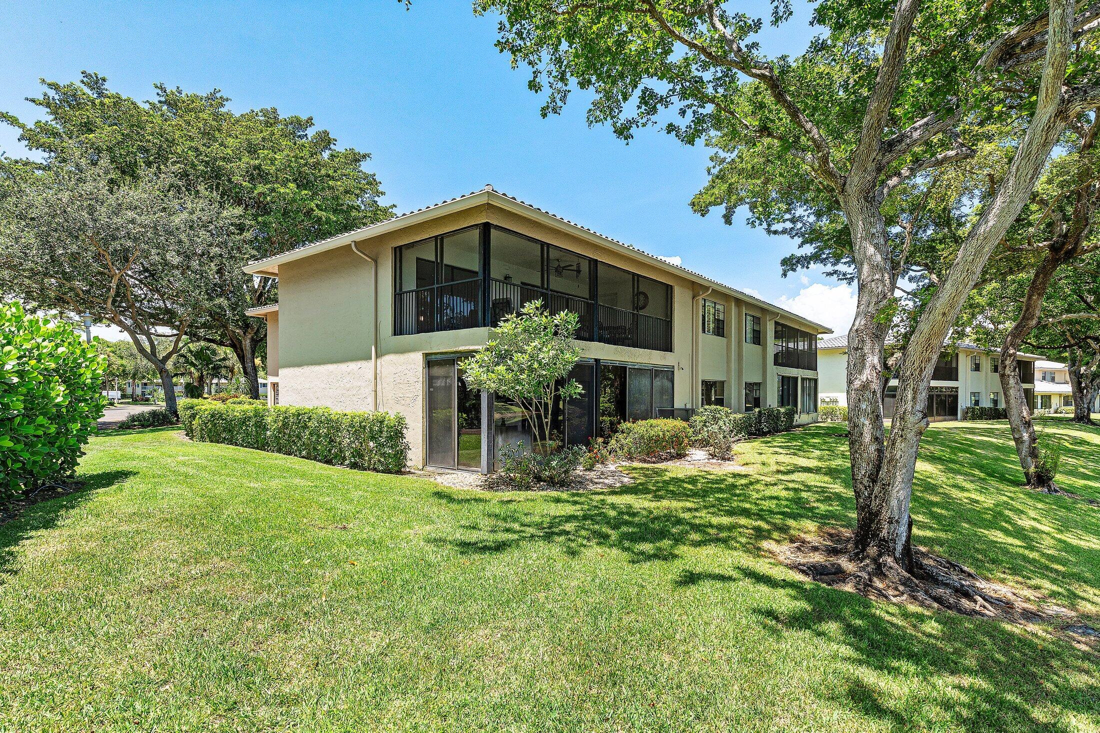 36 Westgate Lane, Unit D Boynton Beach, FL 33436 - Photo 31 of 51 a front view of house with yard and green space