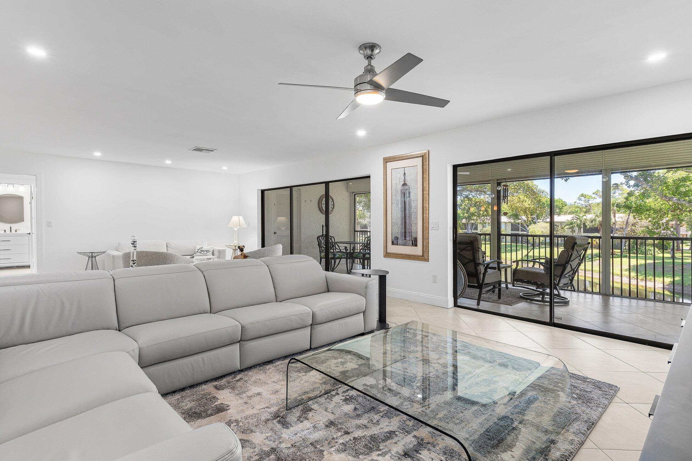 36 Westgate Lane, Unit D Boynton Beach, FL 33436 - Photo 6 of 51 a living room with furniture and a large window
