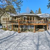 a kitchen with stainless steel appliances granite countertop a stove refrigerator a sink dishwasher with a dining table and chairs