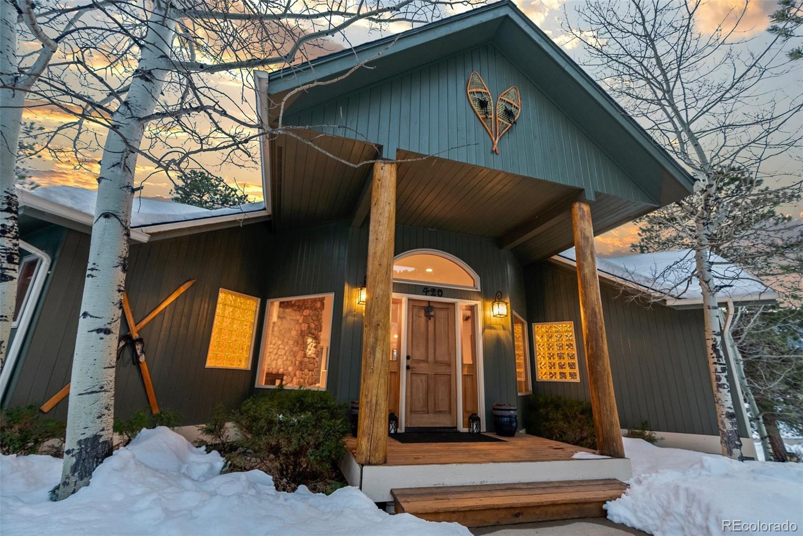 420 Stagecoach Boulevard Evergreen, CO 80439 - Photo 12 of 49 a front view of house with yard