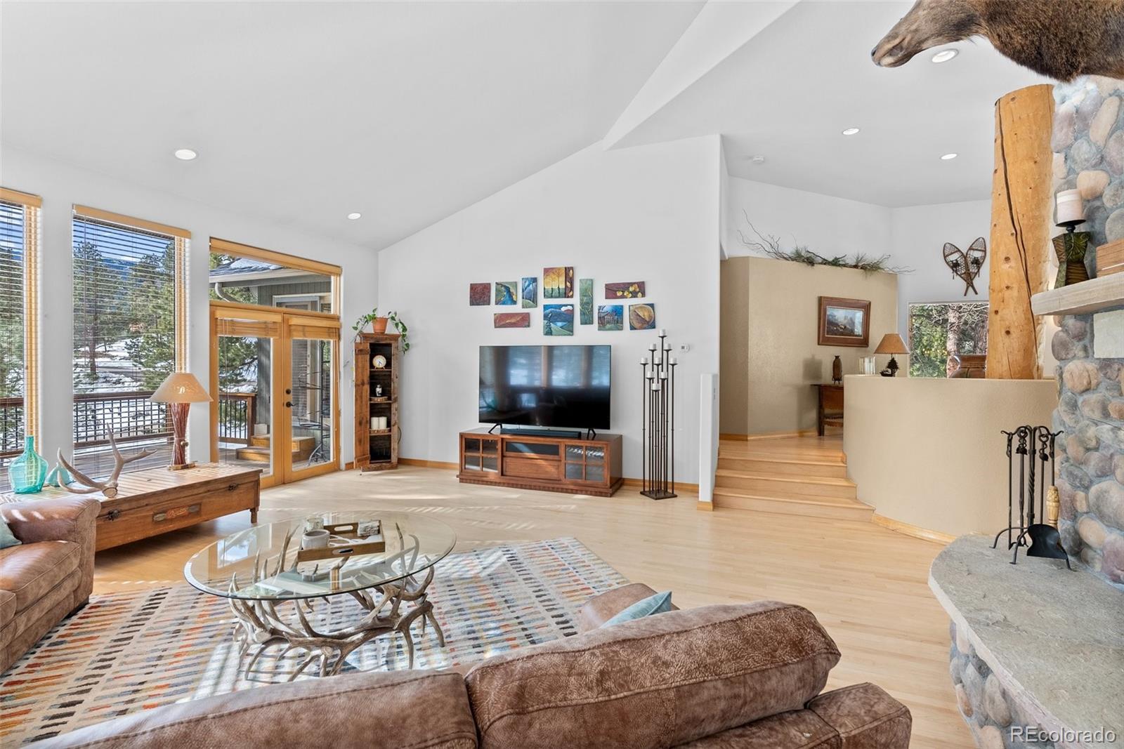 420 Stagecoach Boulevard Evergreen, CO 80439 - Photo 16 of 49 a living room with furniture and a flat screen tv