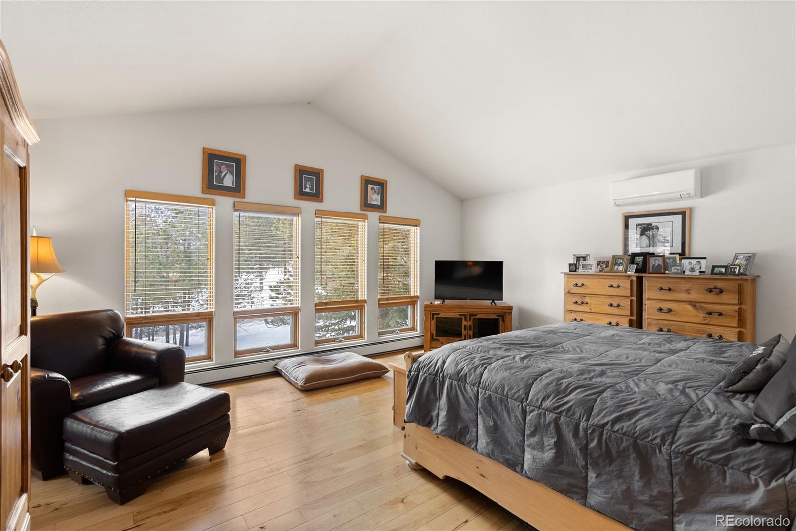 420 Stagecoach Boulevard Evergreen, CO 80439 - Photo 20 of 49 a spacious bedroom with a bed and glass window