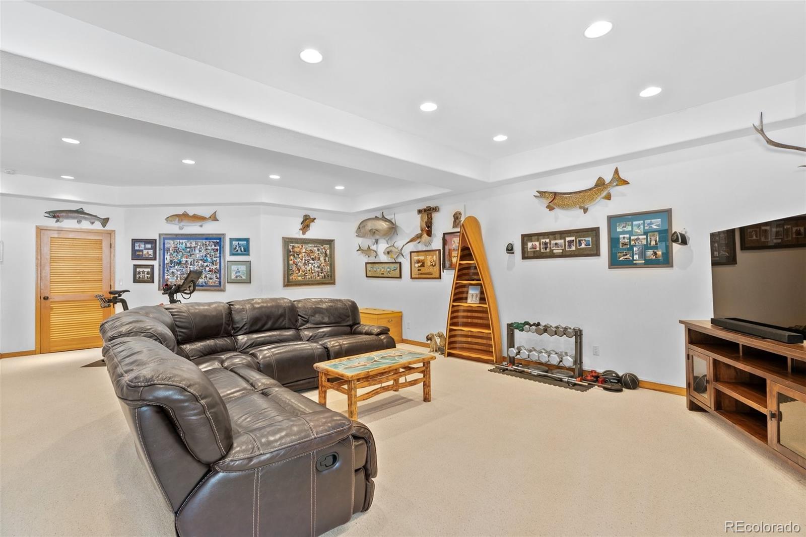 420 Stagecoach Boulevard Evergreen, CO 80439 - Photo 26 of 49 a living room with furniture and a flat screen tv
