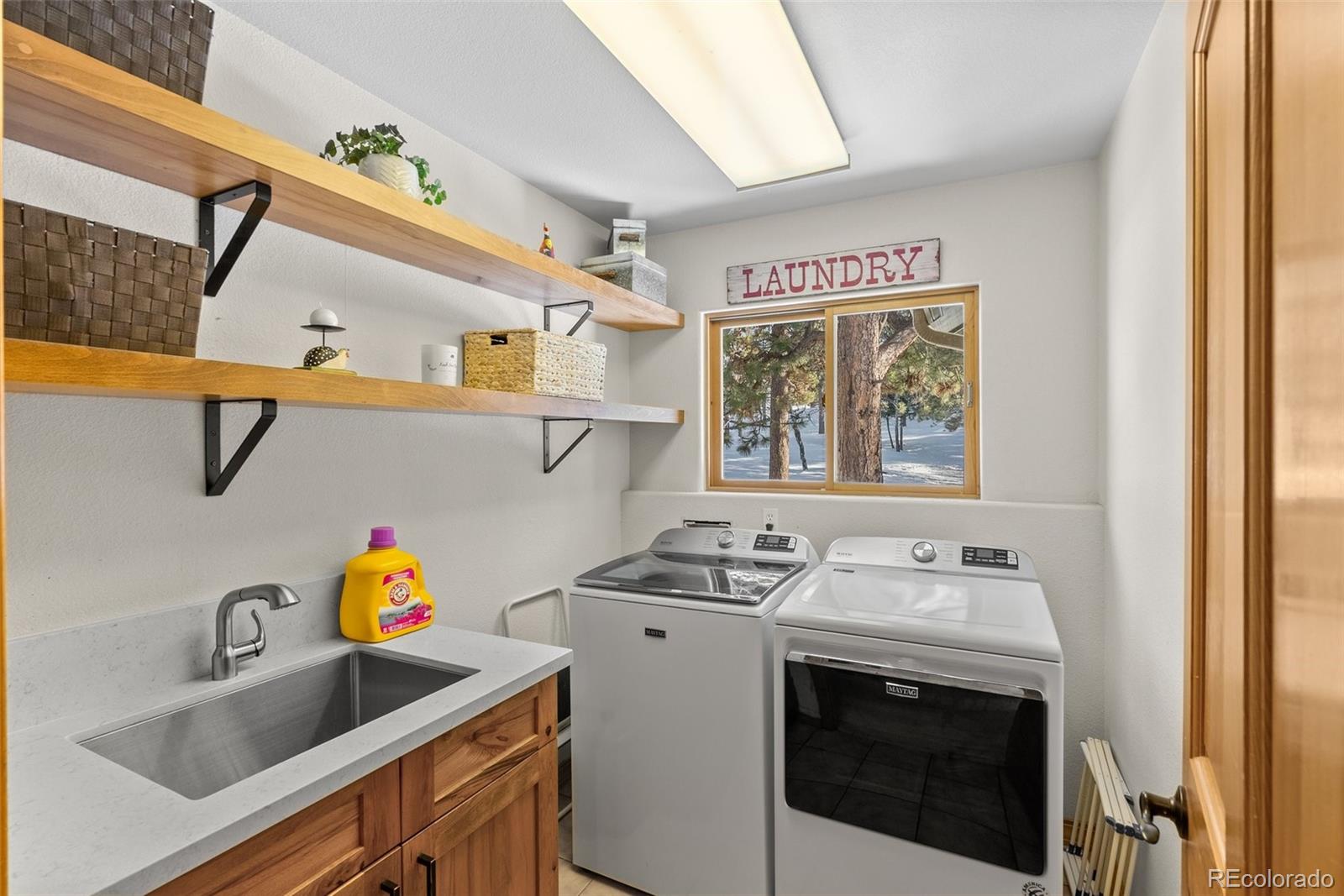 420 Stagecoach Boulevard Evergreen, CO 80439 - Photo 35 of 49 a utility room with sink dryer and washer