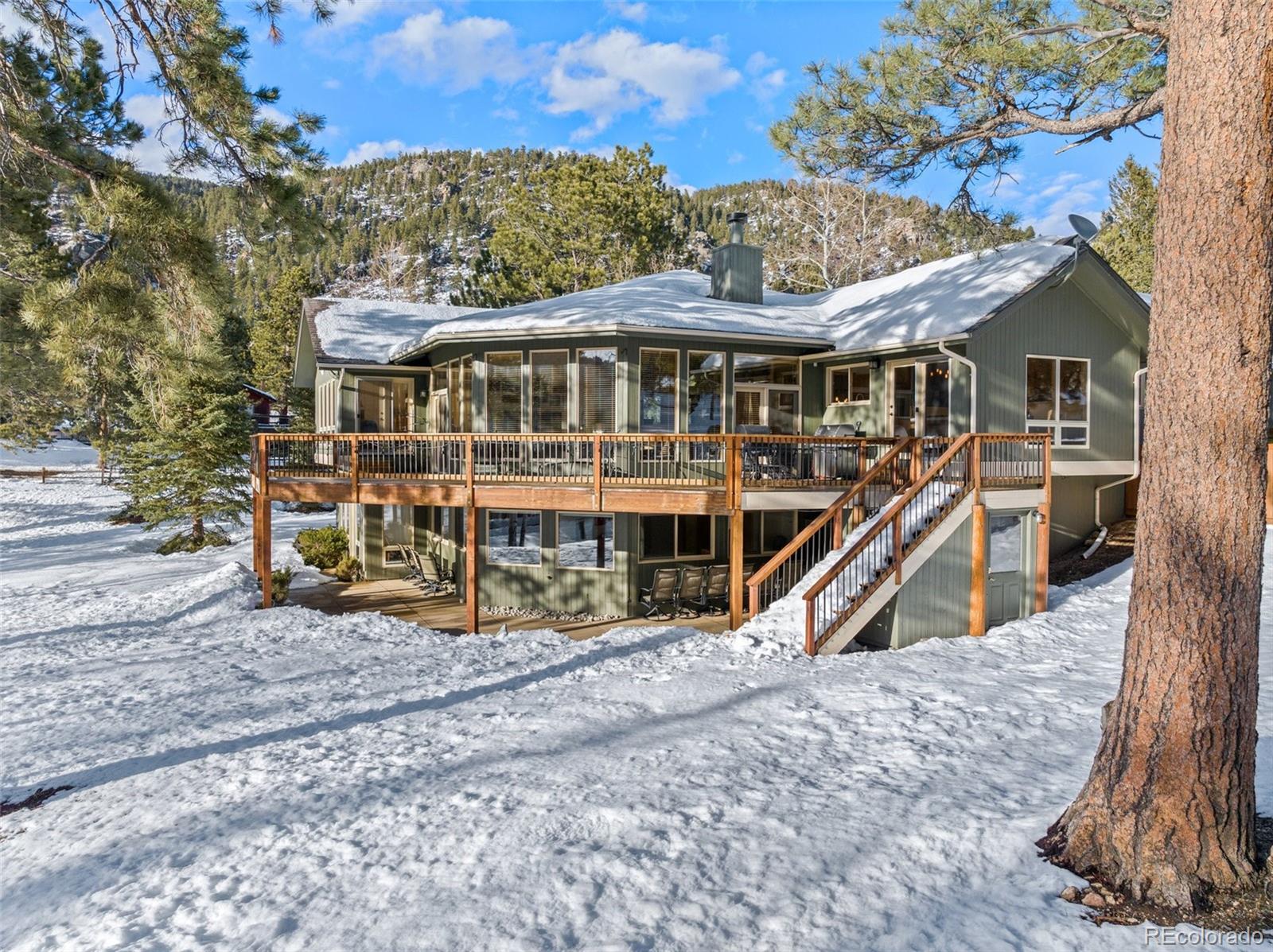 420 Stagecoach Boulevard Evergreen, CO 80439 - Photo 39 of 49 a view of a house with a yard and sitting area