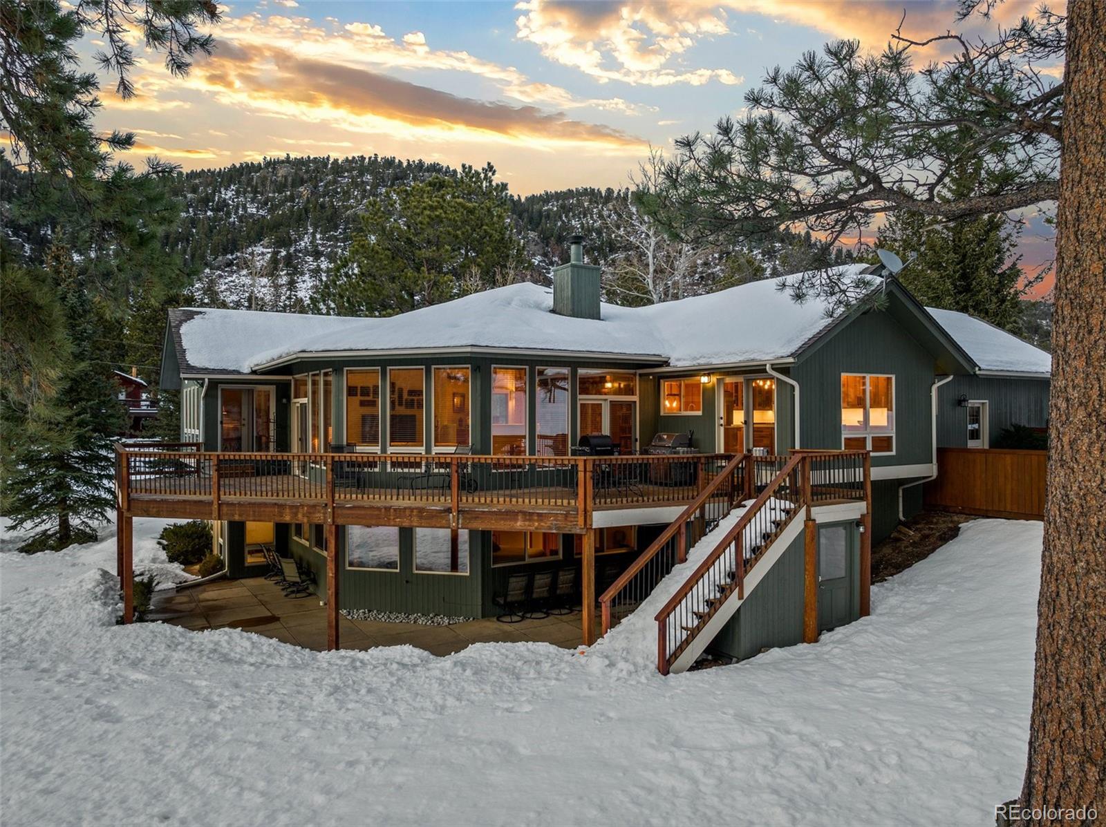 420 Stagecoach Boulevard Evergreen, CO 80439 - Photo 4 of 49 a view of a house with a roof deck