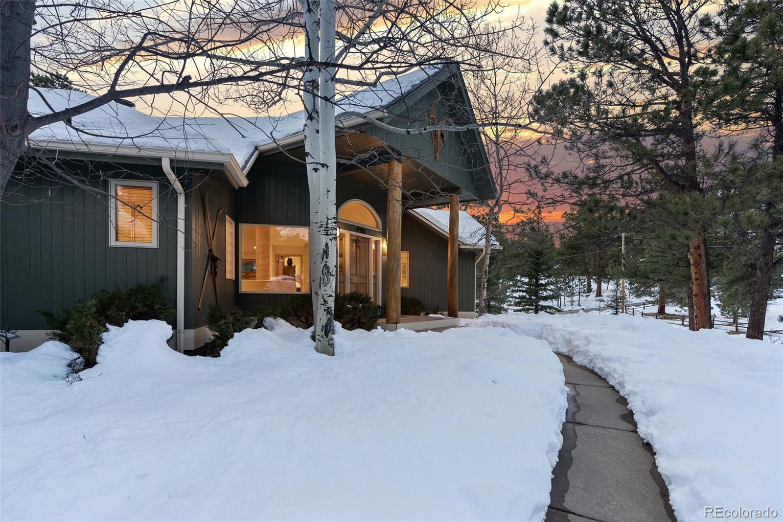 420 Stagecoach Boulevard Evergreen, CO 80439 - Photo 49 of 49 a view of a house with a yard covered in snow