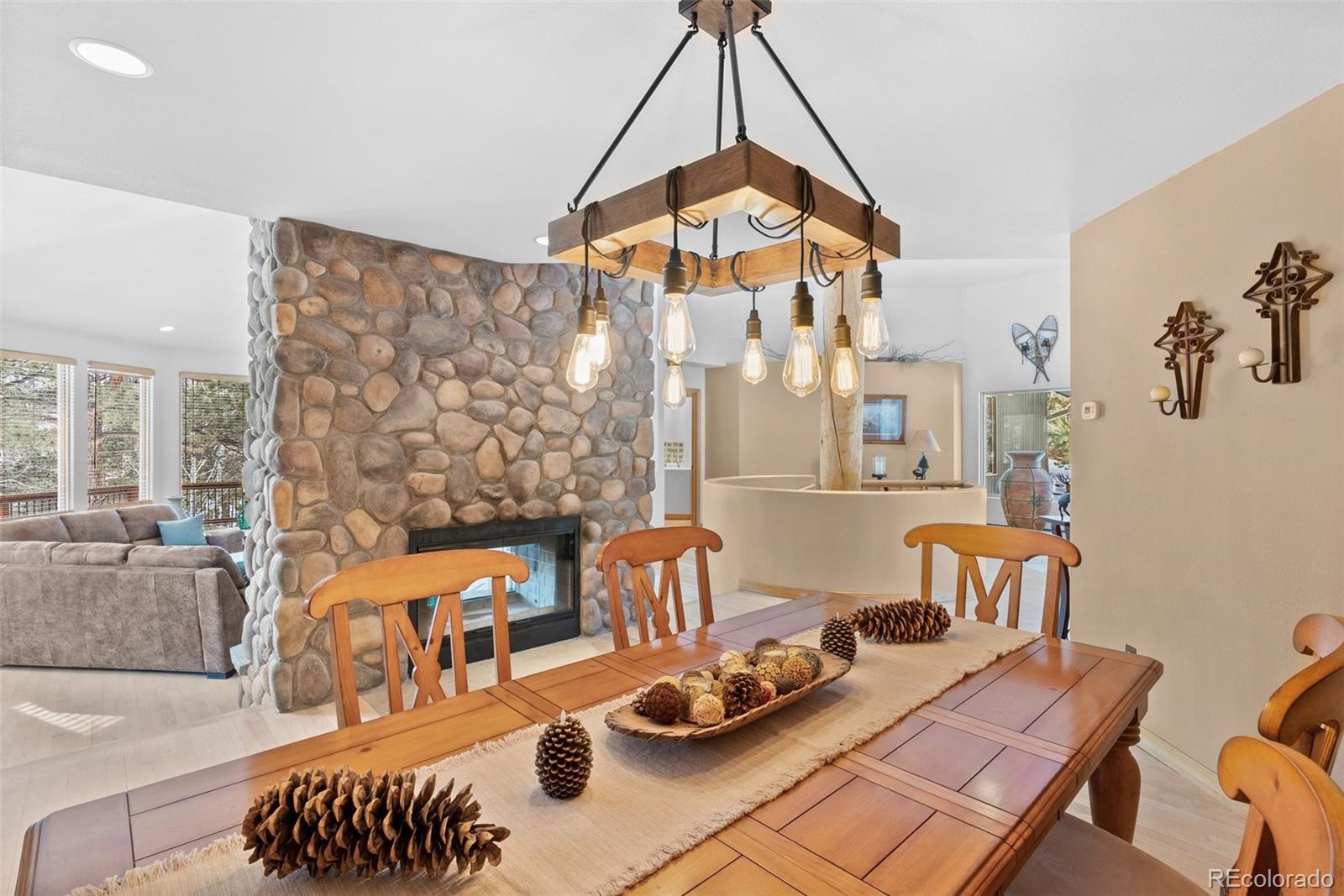 420 Stagecoach Boulevard Evergreen, CO 80439 - Photo 5 of 49 a bedroom with furniture and a wooden floor