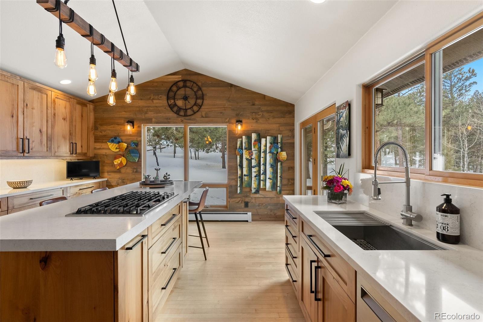 420 Stagecoach Boulevard Evergreen, CO 80439 - Photo 7 of 49 a kitchen that has a sink a stove and a wooden floor