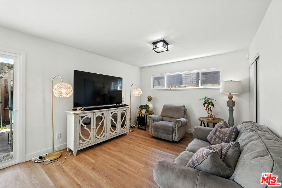 21312 Island Avenue Carson, CA 90745 - Photo 11 of 26 a living room with furniture and a flat screen tv