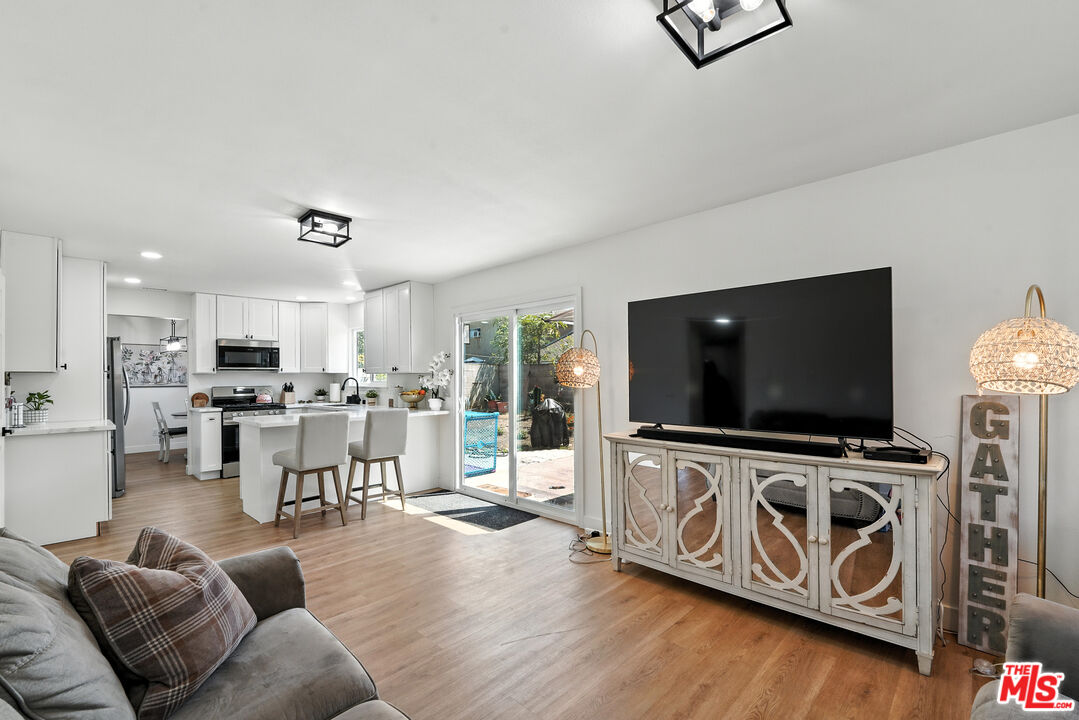 21312 Island Avenue Carson, CA 90745 - Photo 12 of 26 a living room with furniture and a flat screen tv