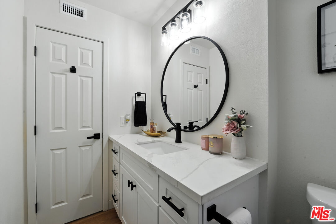 21312 Island Avenue Carson, CA 90745 - Photo 14 of 26 a bathroom with a sink and a mirror