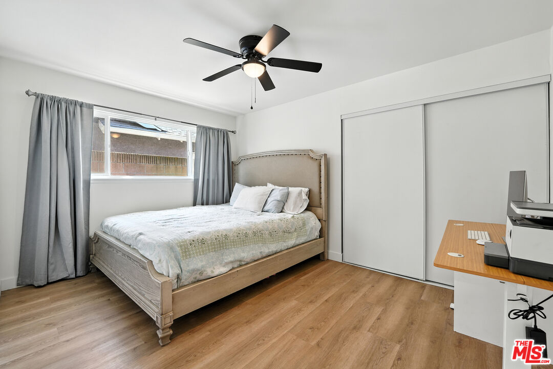 21312 Island Avenue Carson, CA 90745 - Photo 15 of 26 a bedroom with a bed and a flat tv screen on the dresser