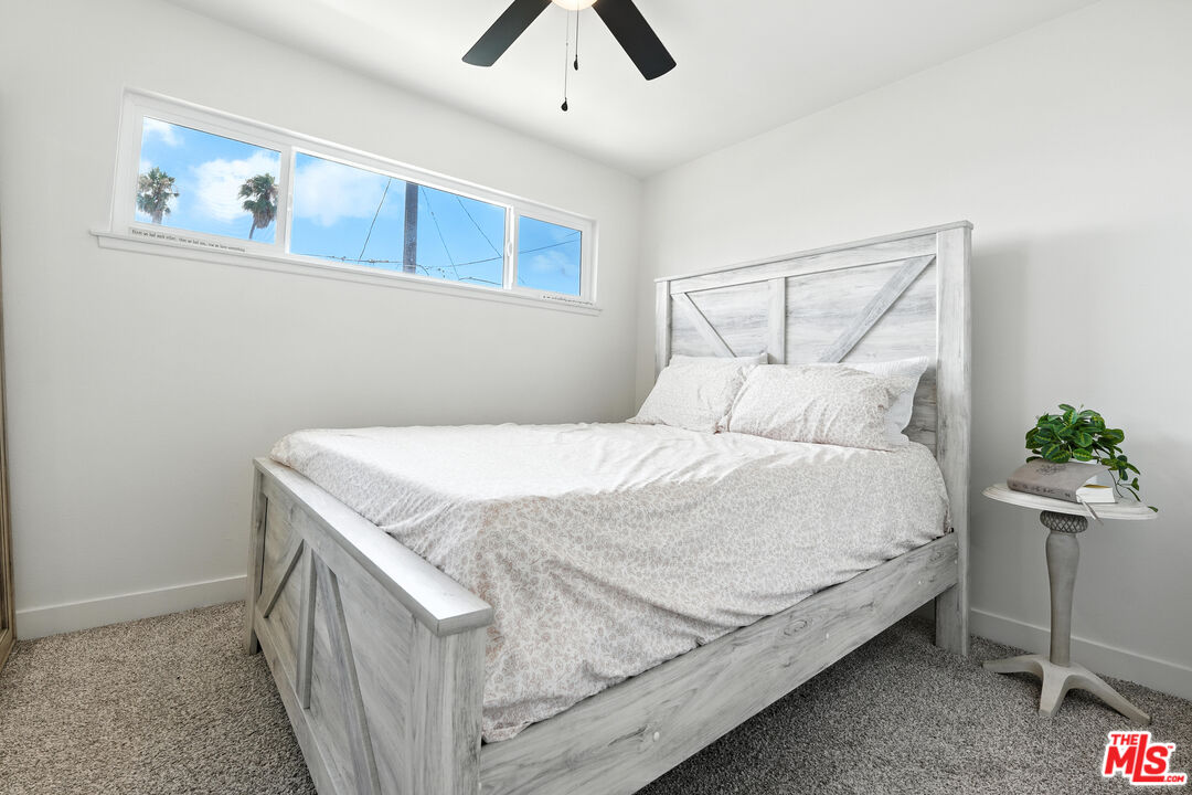 21312 Island Avenue Carson, CA 90745 - Photo 17 of 26 a bedroom with a bed and potted plant