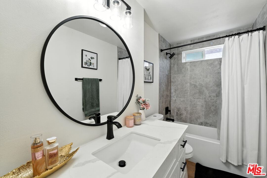 21312 Island Avenue Carson, CA 90745 - Photo 20 of 26 a bathroom with a sink and a mirror