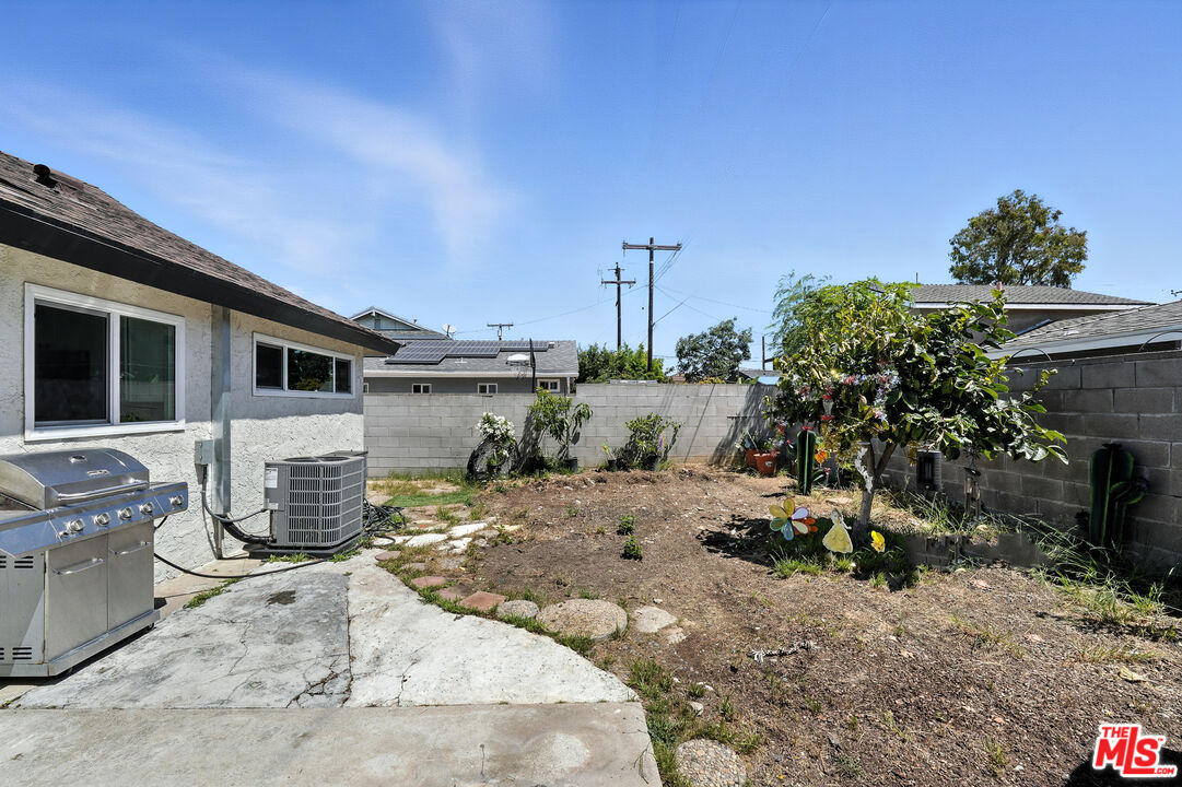 21312 Island Avenue Carson, CA 90745 - Photo 23 of 26 a view of a chair and table in the backyard