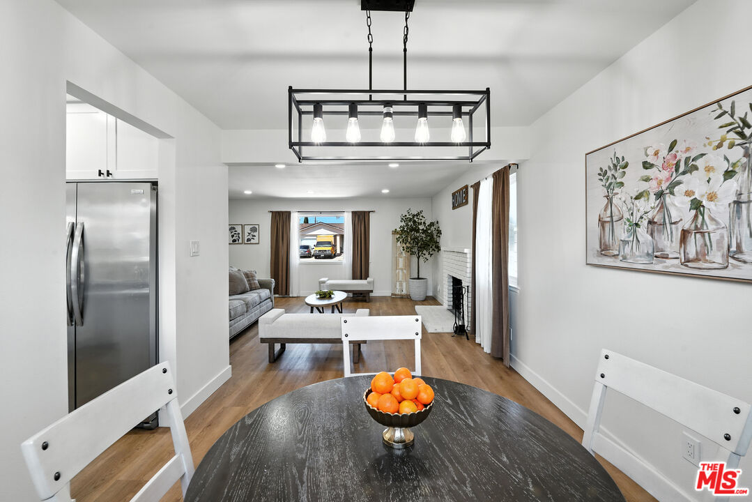 21312 Island Avenue Carson, CA 90745 - Photo 6 of 26 a view of a dining room with furniture a chandelier and wooden floor