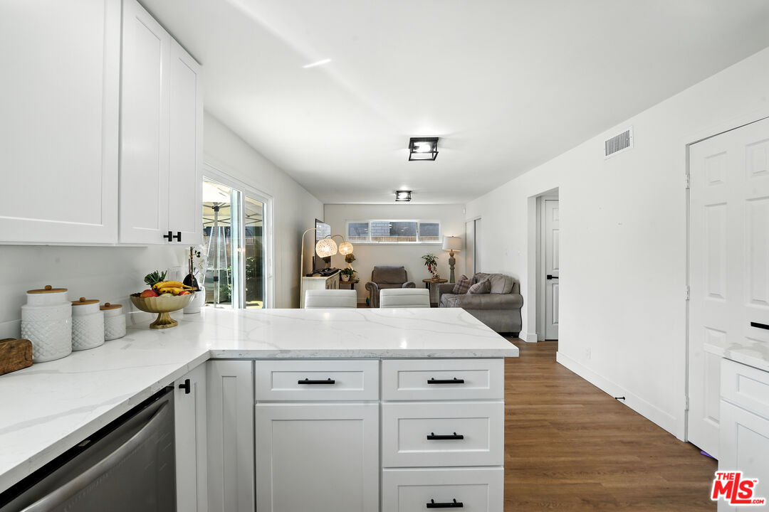 21312 Island Avenue Carson, CA 90745 - Photo 9 of 26 a view of a kitchen counter space and wooden floor