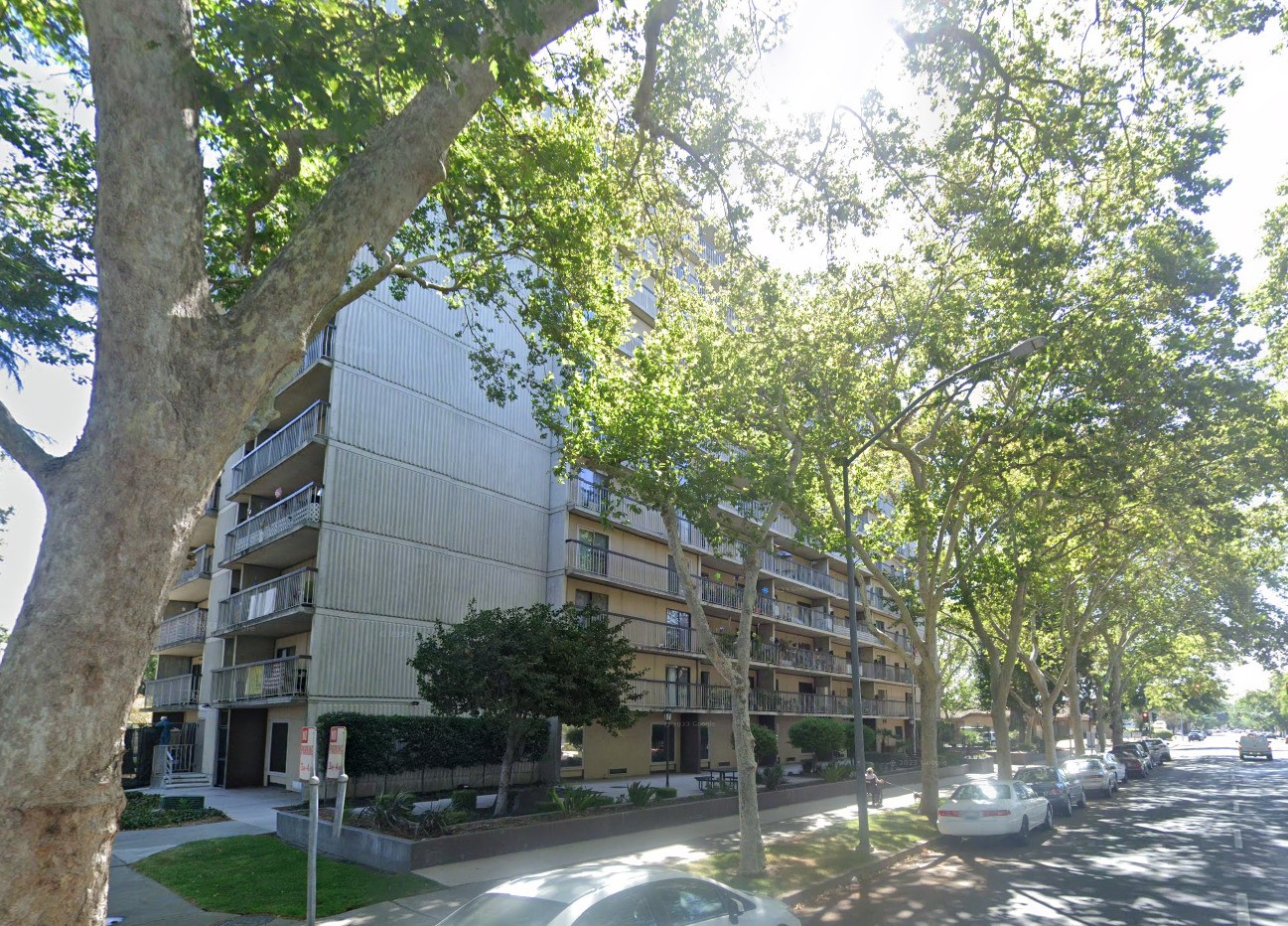 900 17th Street Modesto, CA 95354 - Photo 4 of 8 a view of a tall building with large tree