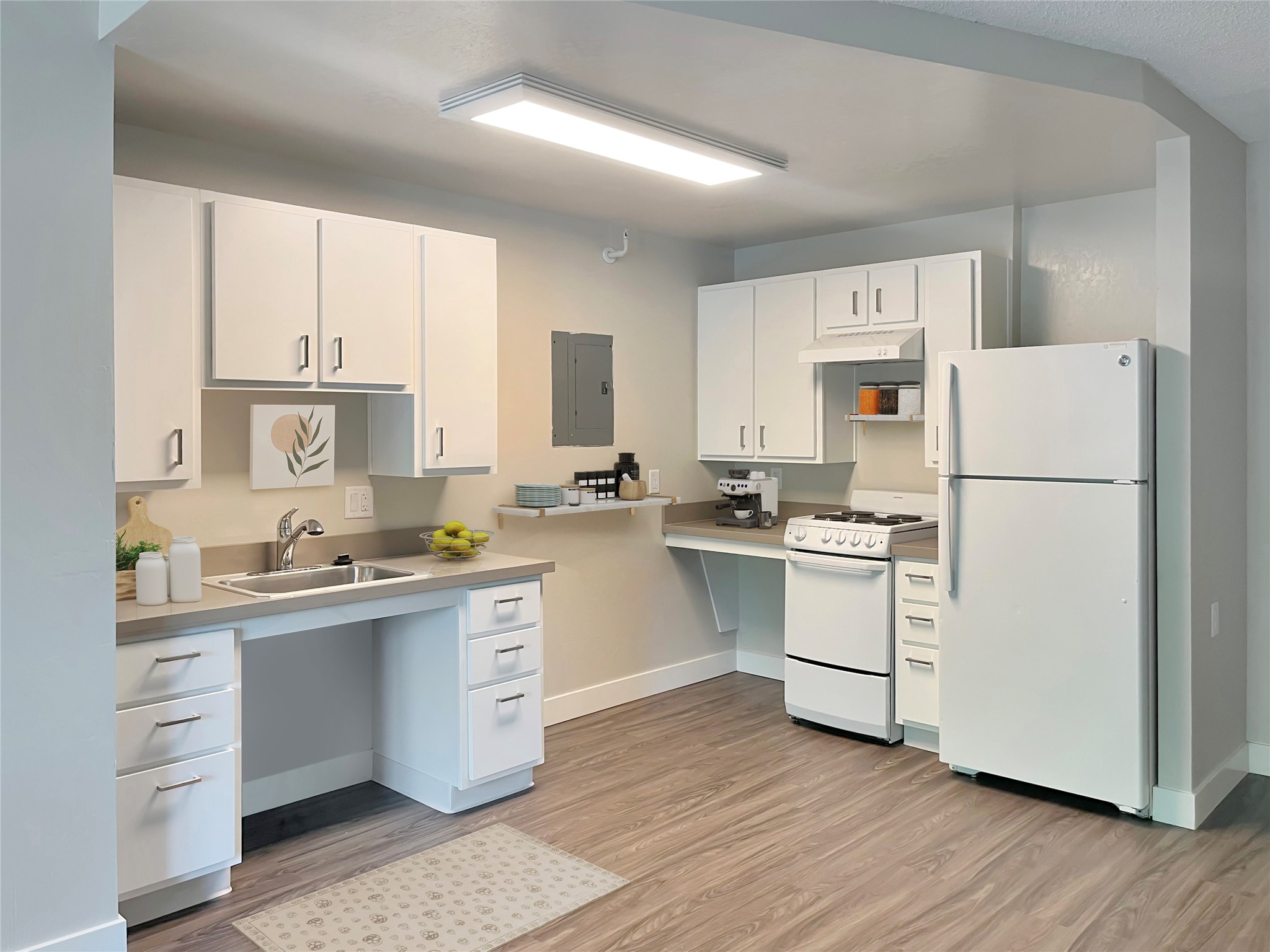 900 17th Street Modesto, CA 95354 - Photo 6 of 8 a kitchen with white cabinets white appliances and sink