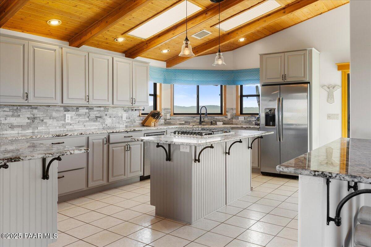 14195 Tapper Trail Prescott, AZ 86305 - Photo 13 of 46 a kitchen with cabinets and stainless steel appliances
