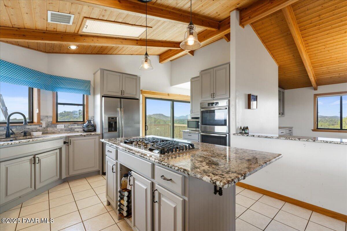 14195 Tapper Trail Prescott, AZ 86305 - Photo 14 of 46 a kitchen with stainless steel appliances granite countertop a sink and cabinets