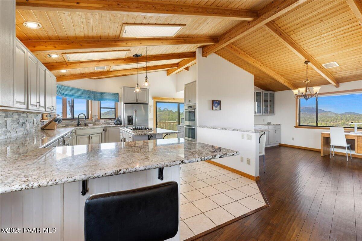 14195 Tapper Trail Prescott, AZ 86305 - Photo 15 of 46 a kitchen with stainless steel appliances granite countertop a sink and cabinets