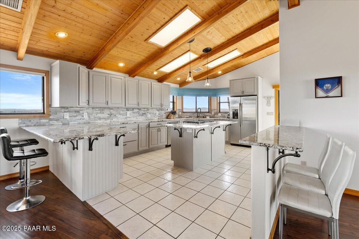 14195 Tapper Trail Prescott, AZ 86305 - Photo 18 of 46 a kitchen with cabinets and chairs