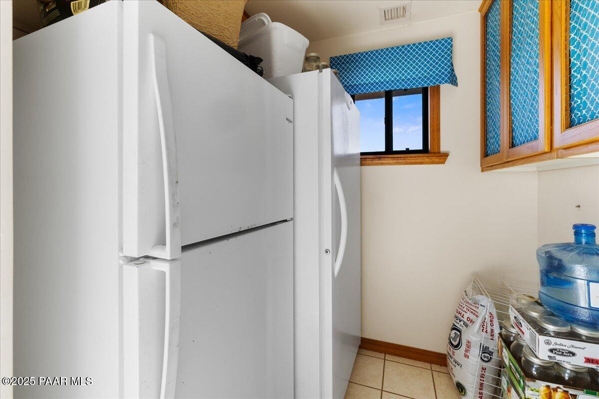 14195 Tapper Trail Prescott, AZ 86305 - Photo 20 of 46 a view of kitchen with wooden floor and cabinets