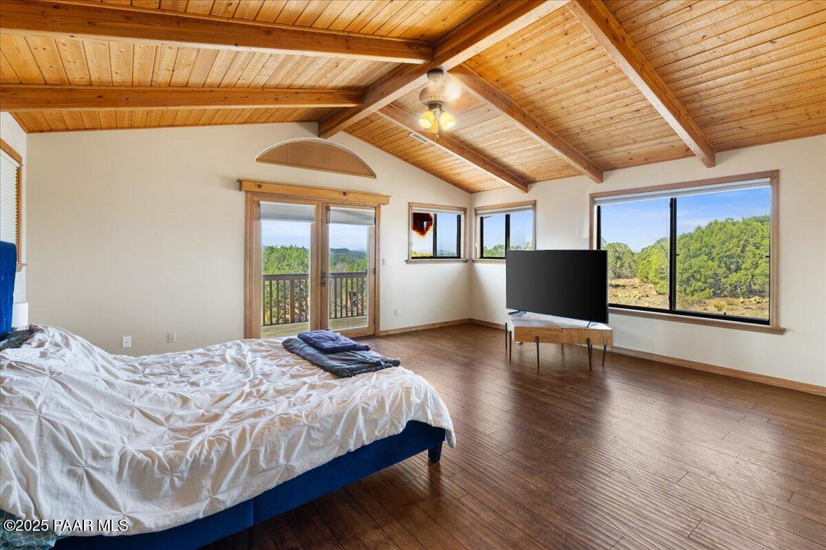 14195 Tapper Trail Prescott, AZ 86305 - Photo 22 of 46 a bedroom with a bed and wooden floor