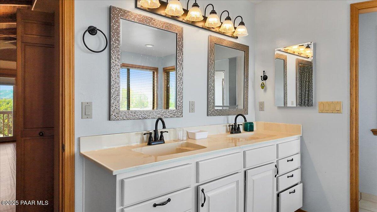 14195 Tapper Trail Prescott, AZ 86305 - Photo 25 of 46 a bathroom with a double vanity sink and a mirror