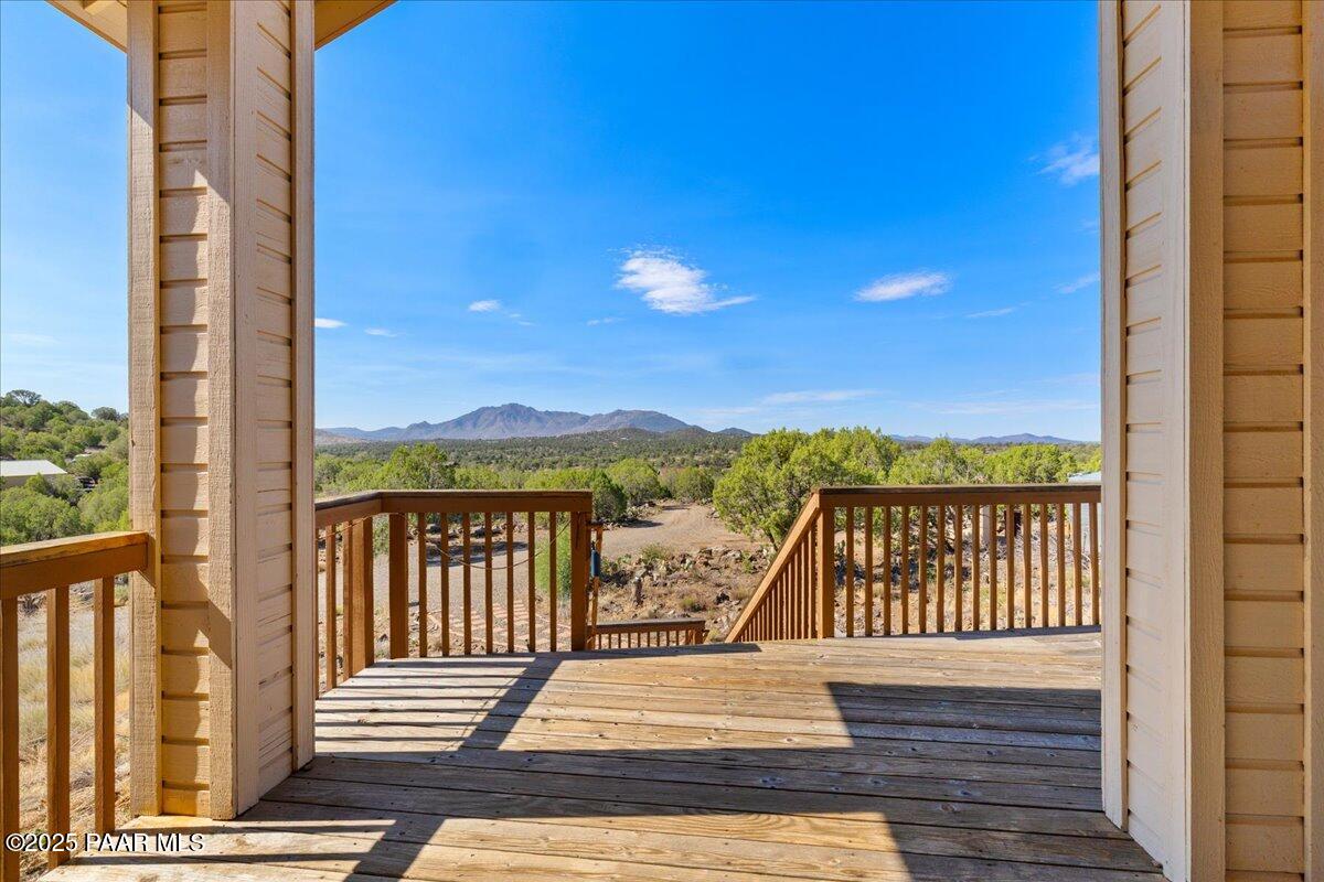 14195 Tapper Trail Prescott, AZ 86305 - Photo 30 of 46 a view of a balcony with wooden floor and fence